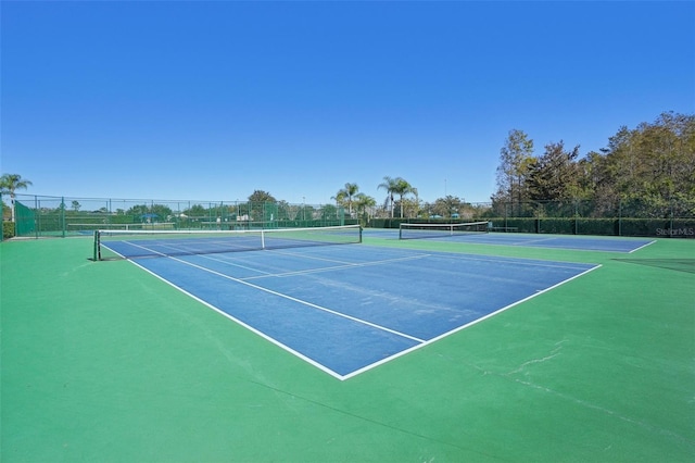 view of sport court featuring basketball hoop