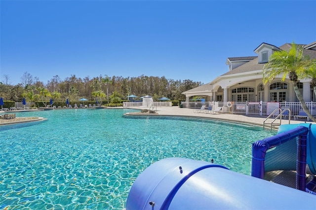 view of swimming pool with a patio