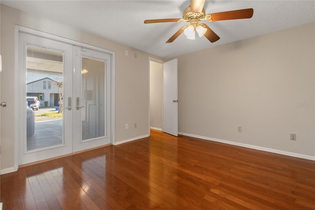 empty room featuring hardwood / wood-style floors, french doors, a textured ceiling, and ceiling fan