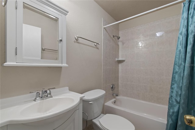 full bathroom with vanity, shower / bath combination with curtain, and toilet