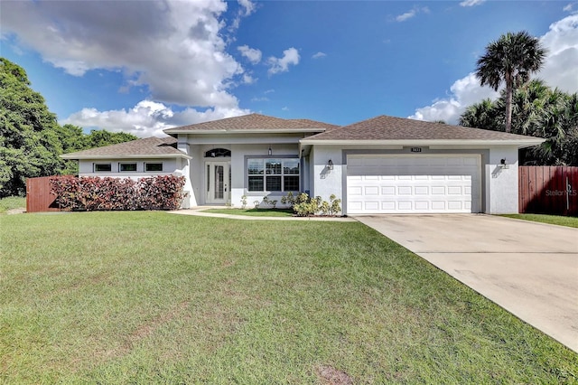 view of front facade with a front yard and a garage