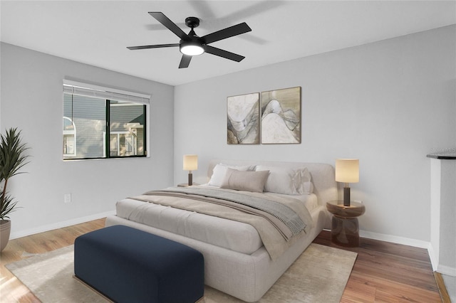 bedroom featuring ceiling fan and light hardwood / wood-style floors