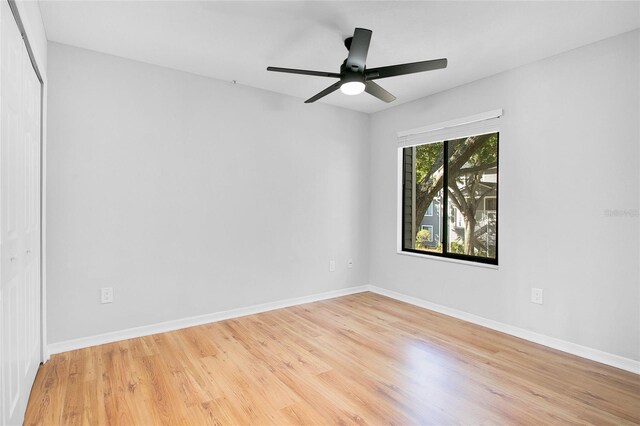 unfurnished room with ceiling fan and light hardwood / wood-style floors