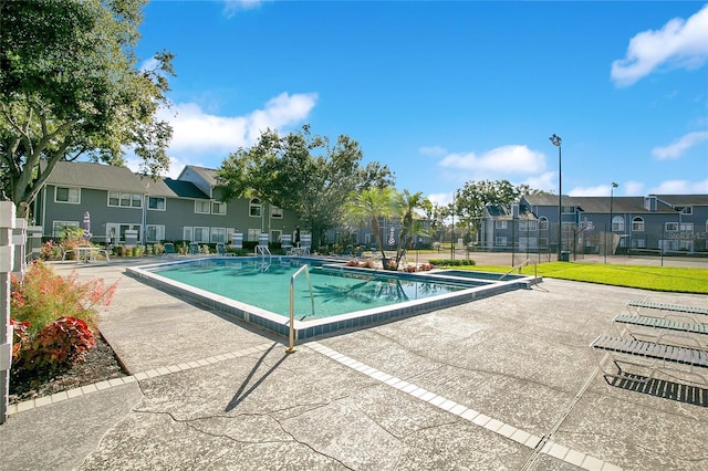 view of swimming pool with a patio area