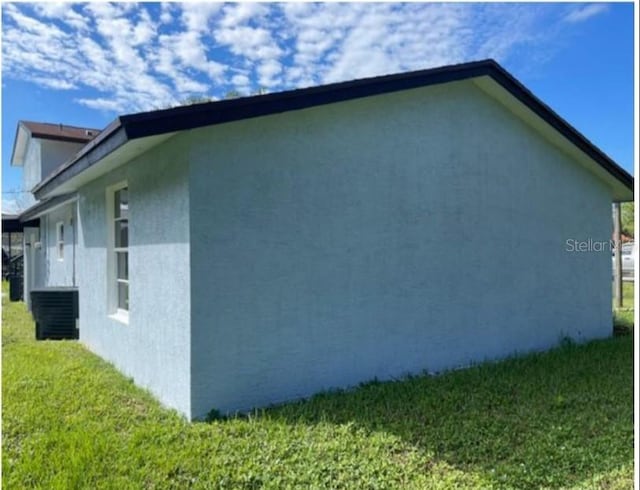 view of home's exterior featuring a yard