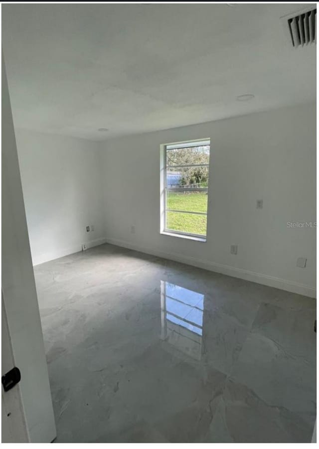 3458 NW 28th Ave, Okeechobee, FL 34972 - spare room featuring baseboards