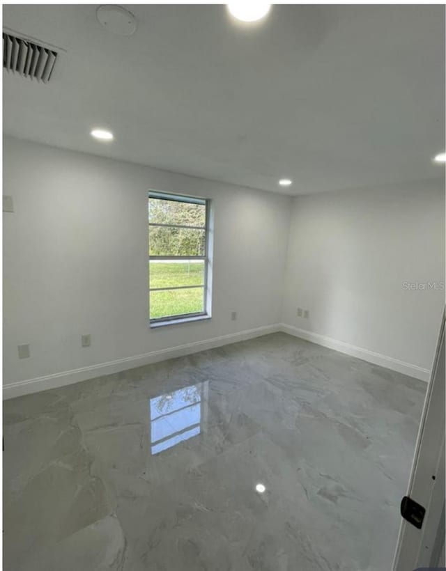 3458 NW 28th Ave, Okeechobee, FL 34972 - spare room with recessed lighting and marble finish floors