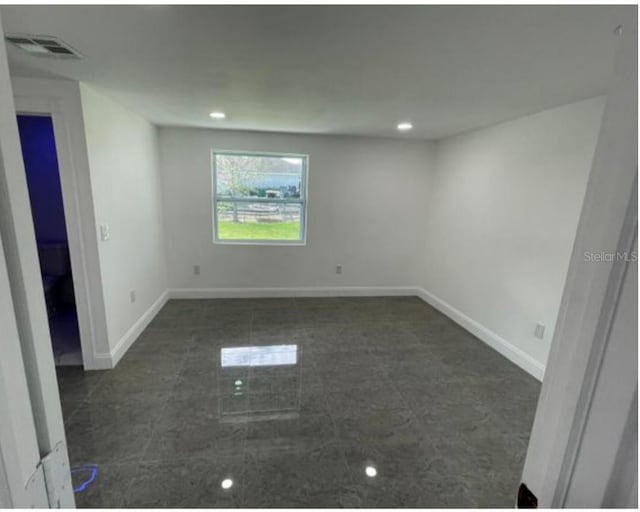 3458 NW 28th Ave, Okeechobee, FL 34972 - empty room with baseboards and recessed lighting