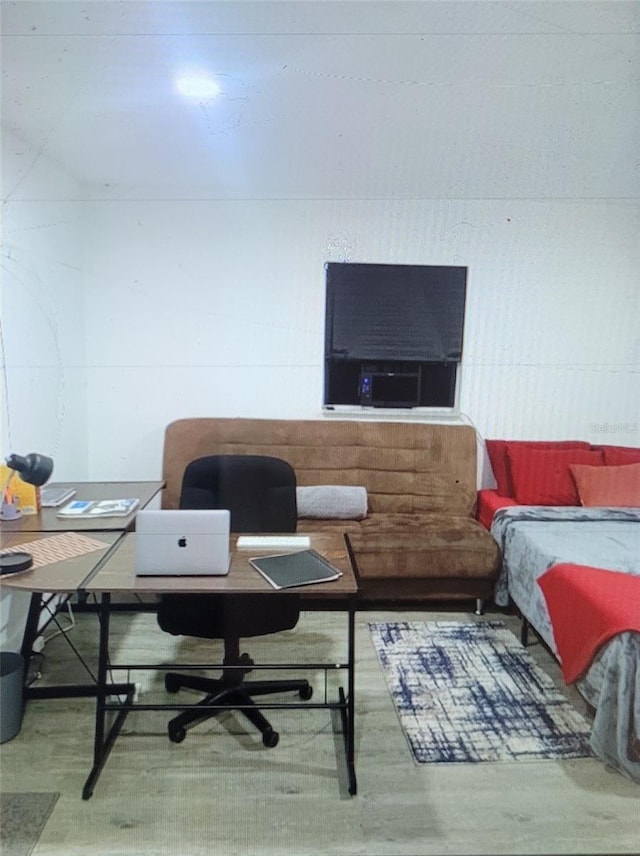 3458 NW 28th Ave, Okeechobee, FL 34972 - bedroom with a desk and wood finished floors