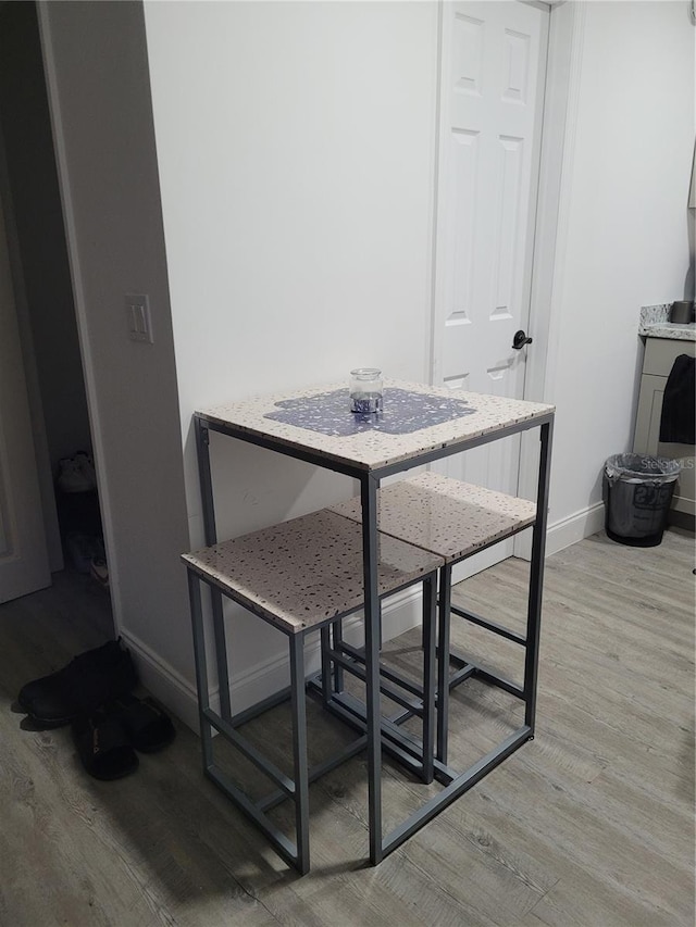 3458 NW 28th Ave, Okeechobee, FL 34972 - dining space featuring light wood-style floors and baseboards