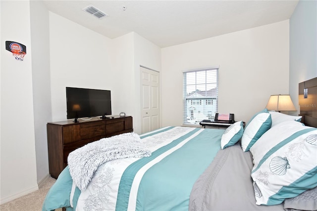 carpeted bedroom with a closet