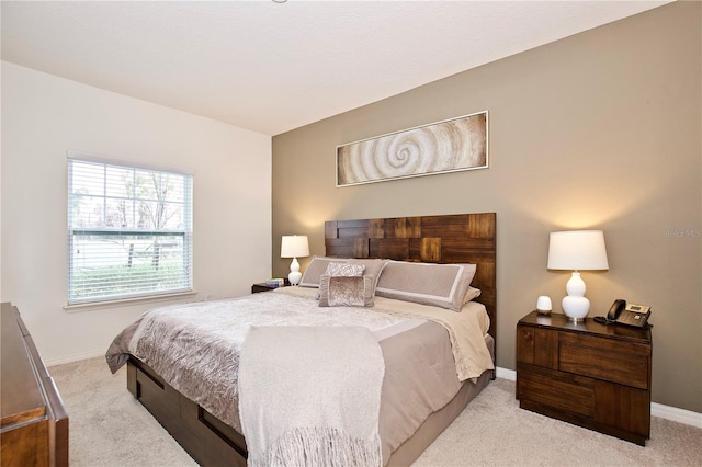 bedroom featuring light colored carpet