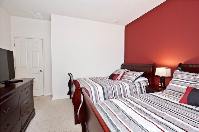 bedroom featuring light carpet