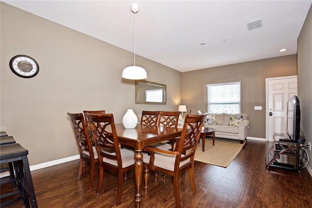 dining space featuring dark hardwood / wood-style flooring