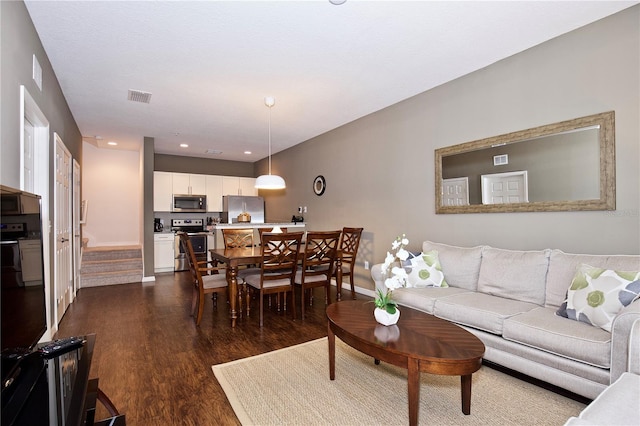 living room featuring dark hardwood / wood-style flooring