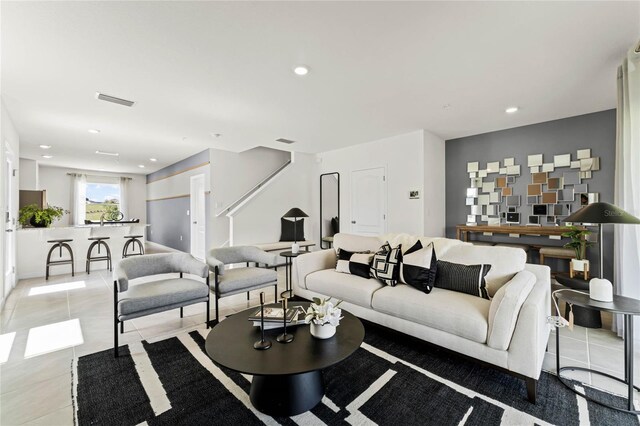 living room featuring light tile patterned flooring