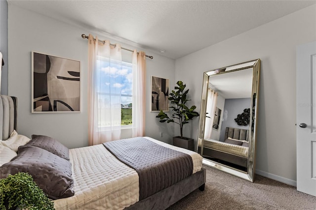 carpeted bedroom with a textured ceiling