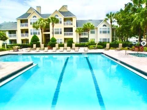 1023 S Hiawassee Rd Unit 4022, Orlando, FL 32835 - community pool with a patio area