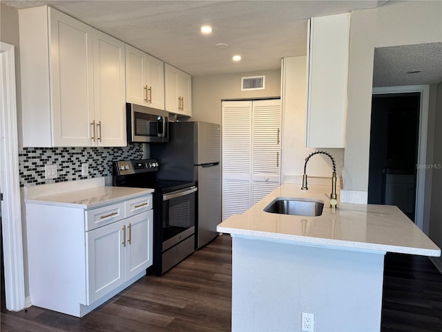 1023 S Hiawassee Rd Unit 4022, Orlando, FL 32835 - kitchen with stainless steel appliances, a sink, dark wood-style flooring, a peninsula, and recessed lighting