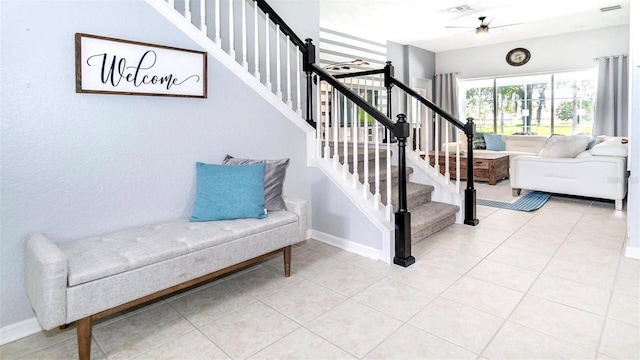 staircase with tile patterned floors