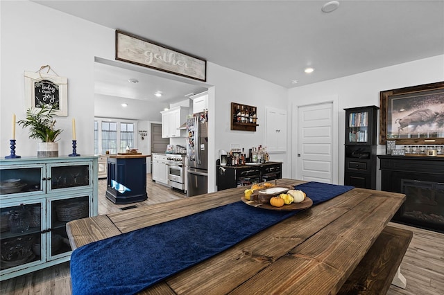 dining room with hardwood / wood-style flooring