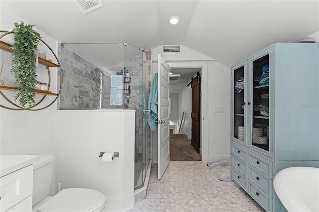 bathroom with toilet, vanity, vaulted ceiling, and an enclosed shower