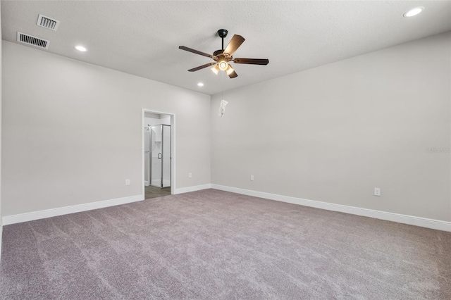 carpeted spare room featuring recessed lighting, visible vents, a ceiling fan, and baseboards