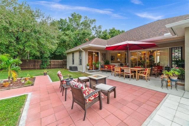 view of patio / terrace featuring an outdoor living space with a fire pit