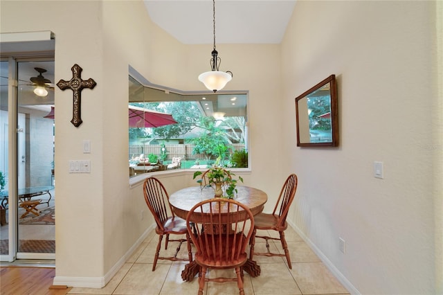 dining area with light tile patterned floors