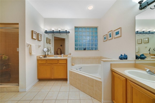 bathroom with tile patterned floors, vanity, and independent shower and bath