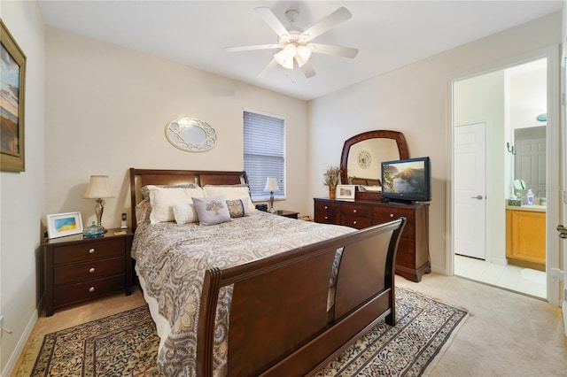 carpeted bedroom with connected bathroom and ceiling fan