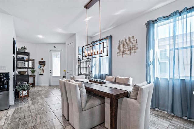 dining space featuring plenty of natural light