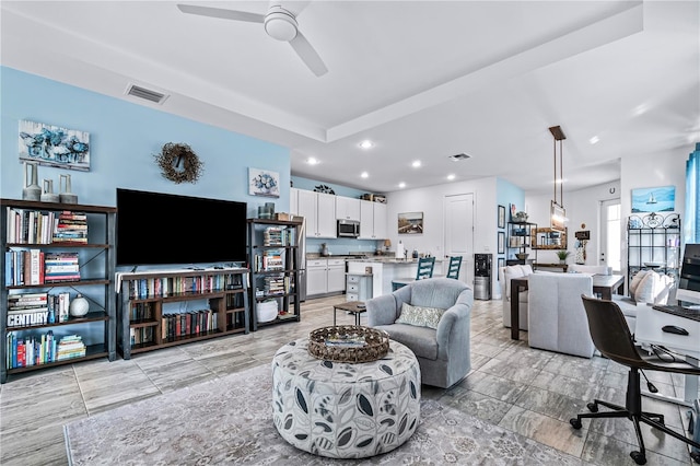 living room featuring ceiling fan