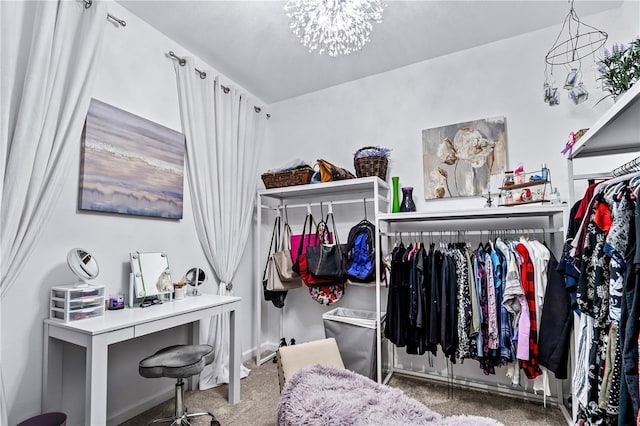 spacious closet with carpet floors and a chandelier