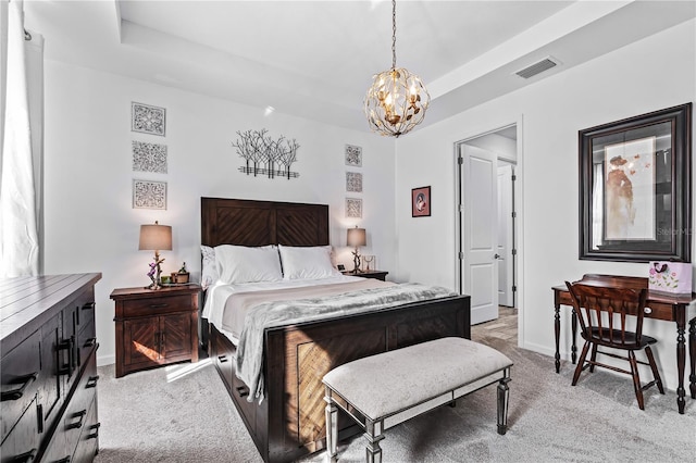 bedroom featuring a notable chandelier and light carpet