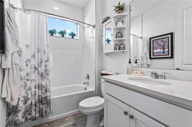 full bathroom featuring shower / bath combination with curtain, vanity, toilet, and hardwood / wood-style floors