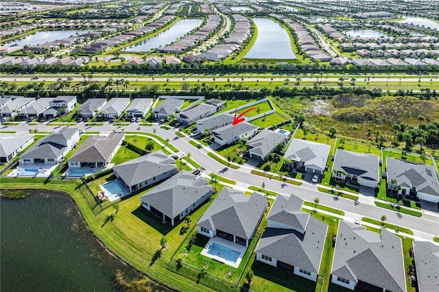 drone / aerial view featuring a water view