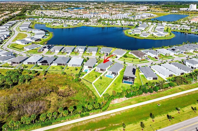 birds eye view of property featuring a water view