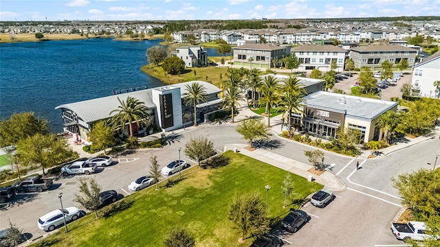 aerial view with a water view and a residential view