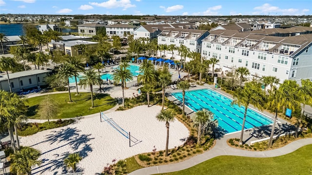 community pool with a residential view