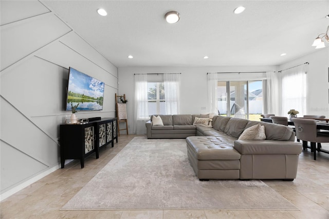 living room featuring an inviting chandelier