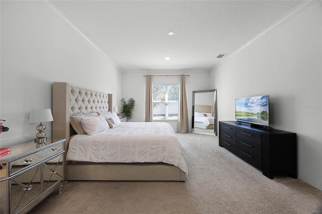 carpeted bedroom featuring ornamental molding and a textured ceiling