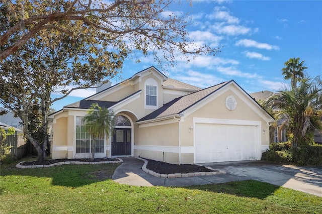 view of front of property featuring a front yard and a garage