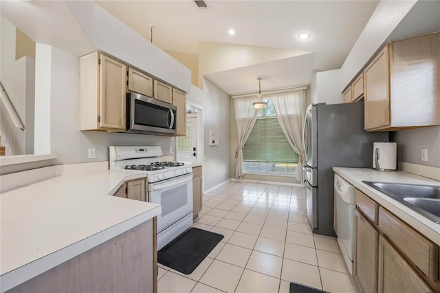 kitchen featuring pendant lighting, vaulted ceiling, white appliances, light brown cabinetry, and light tile patterned floors