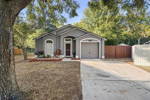 ranch-style house featuring a garage