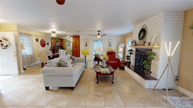 living room featuring a fireplace, baseboards, and light tile patterned flooring