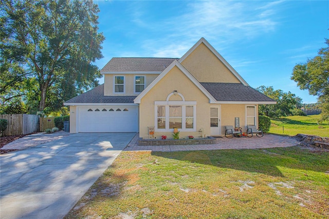 view of front of house featuring a garage and a front yard