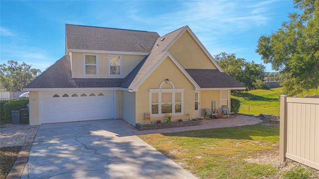 front facade with a garage and a front lawn