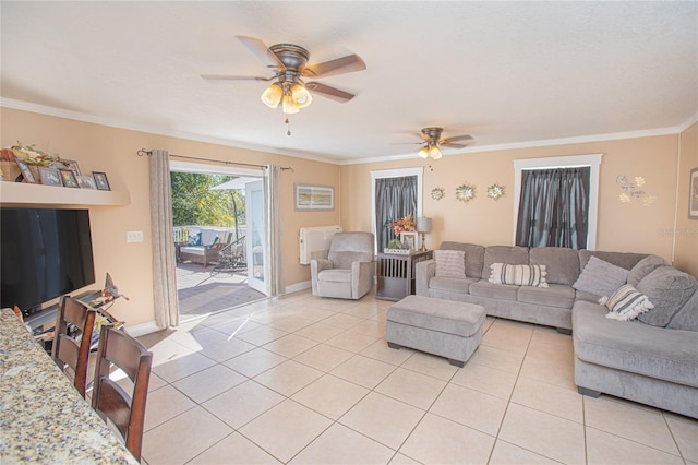 tiled living room featuring ceiling fan and crown molding