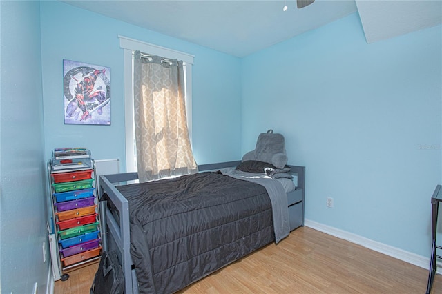 bedroom featuring hardwood / wood-style flooring